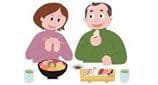 寿司を食べる夫婦
